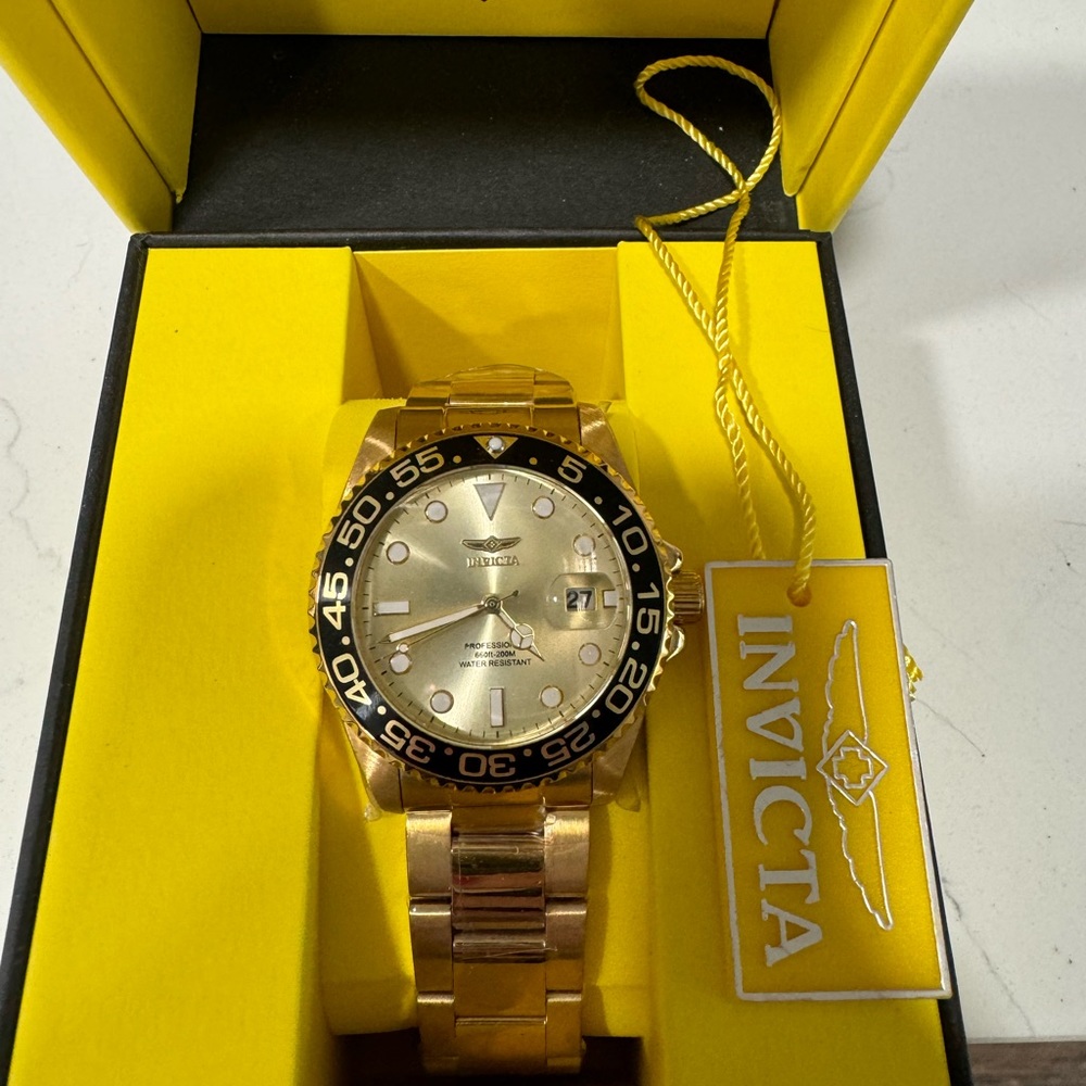 Invicta gold and black women’s watch